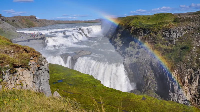 A rainbow in the spray above Gullfoss waterfall and its canyon