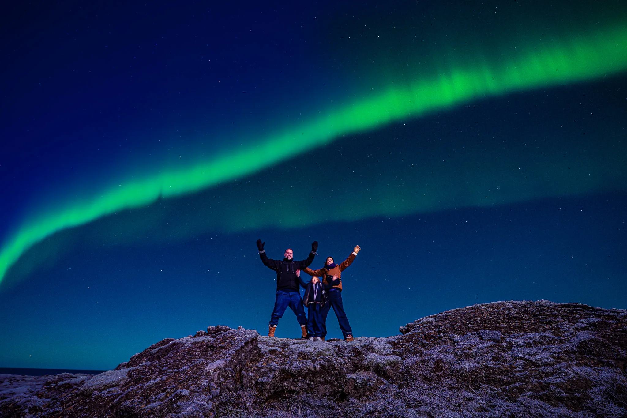 Aurora borealis above a dark Icelandic horizon