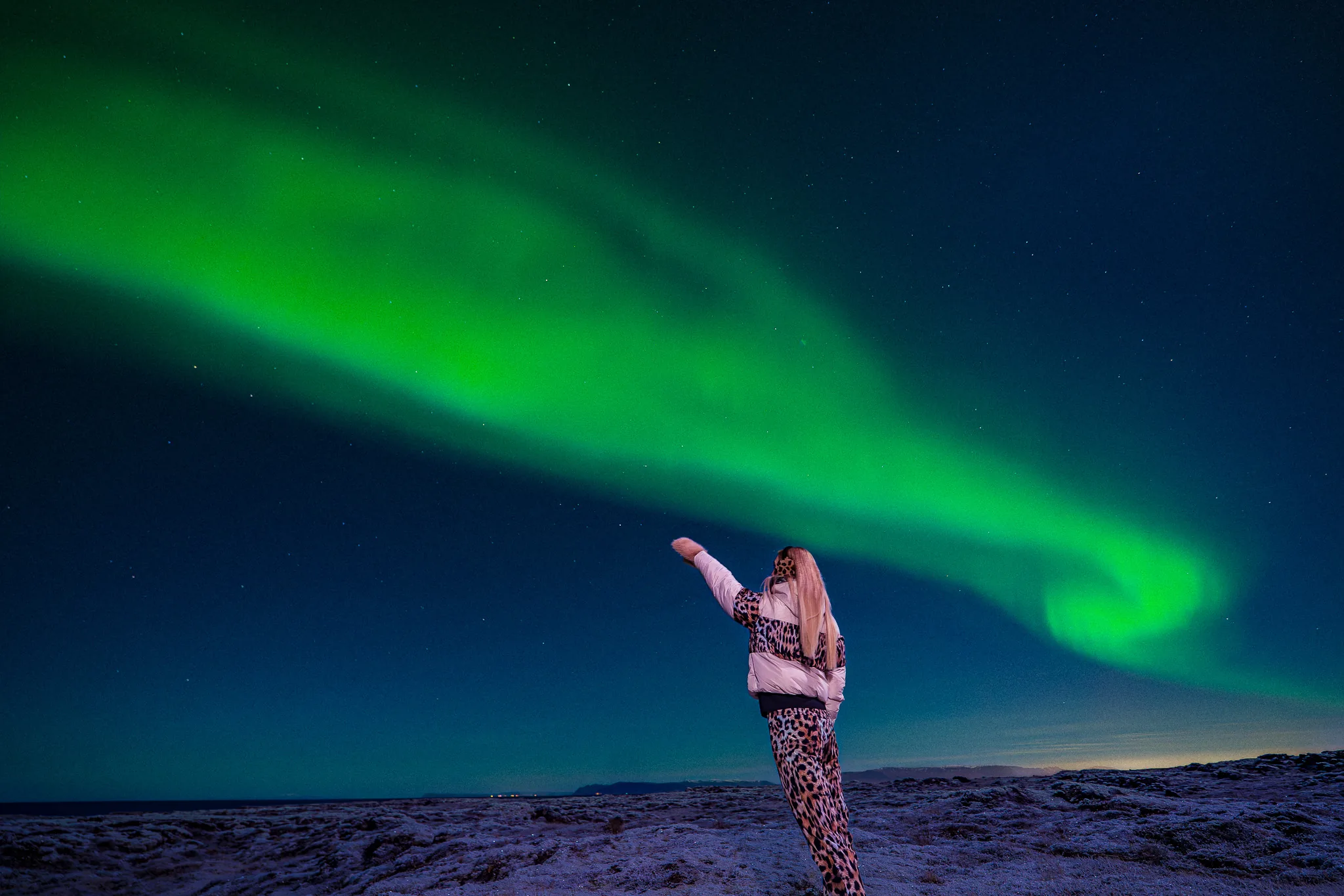 Green northern lights across the Icelandic night sky