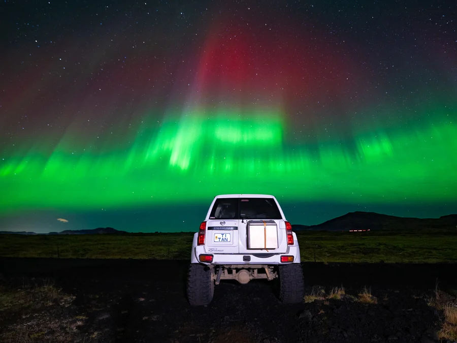 Northern lights above a winter Iceland landscape