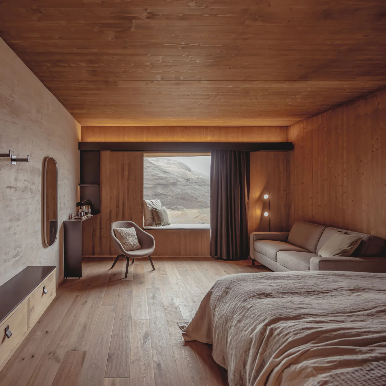 Warm wood-lined guest room at Highland Base