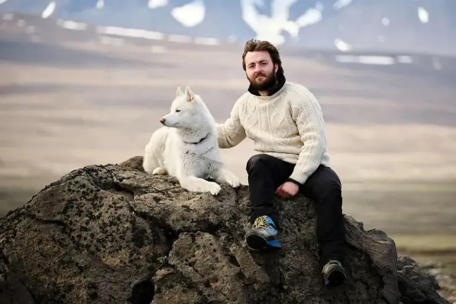 Guests sharing stories around an Icelandic camp