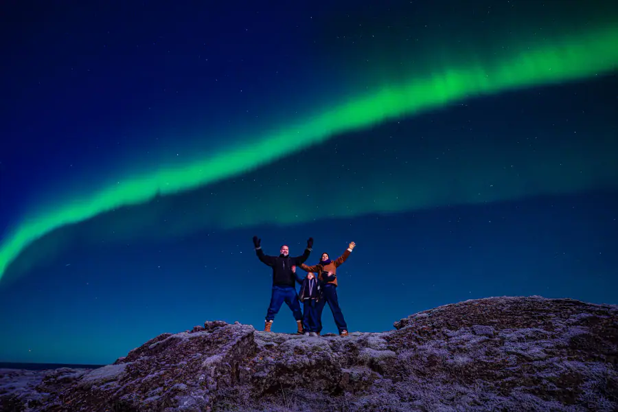 Aurora borealis above a dark Icelandic horizon