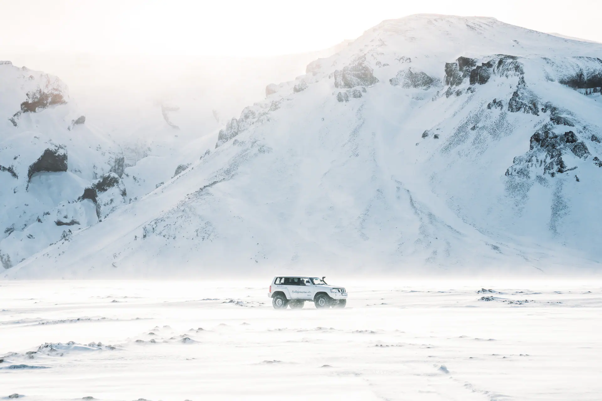Winter road and snowy Icelandic landscape