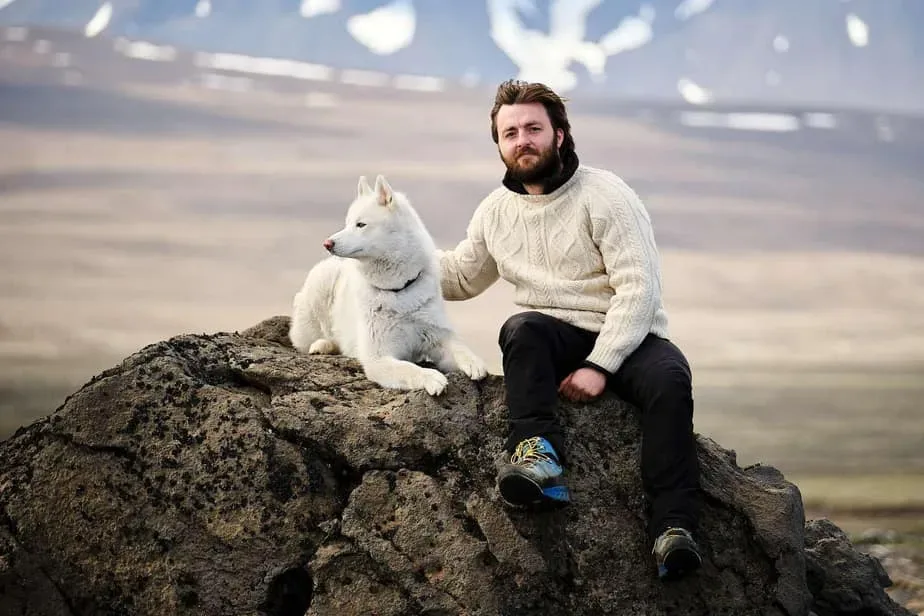 Guests sharing stories around an Icelandic camp