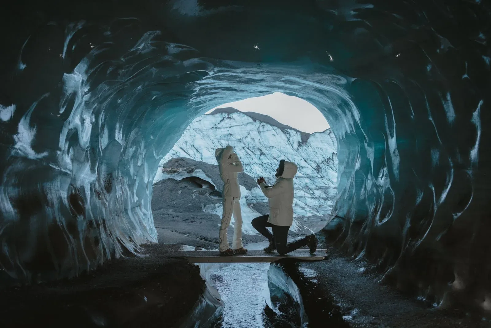 Traveler inside a blue ice cave in Iceland