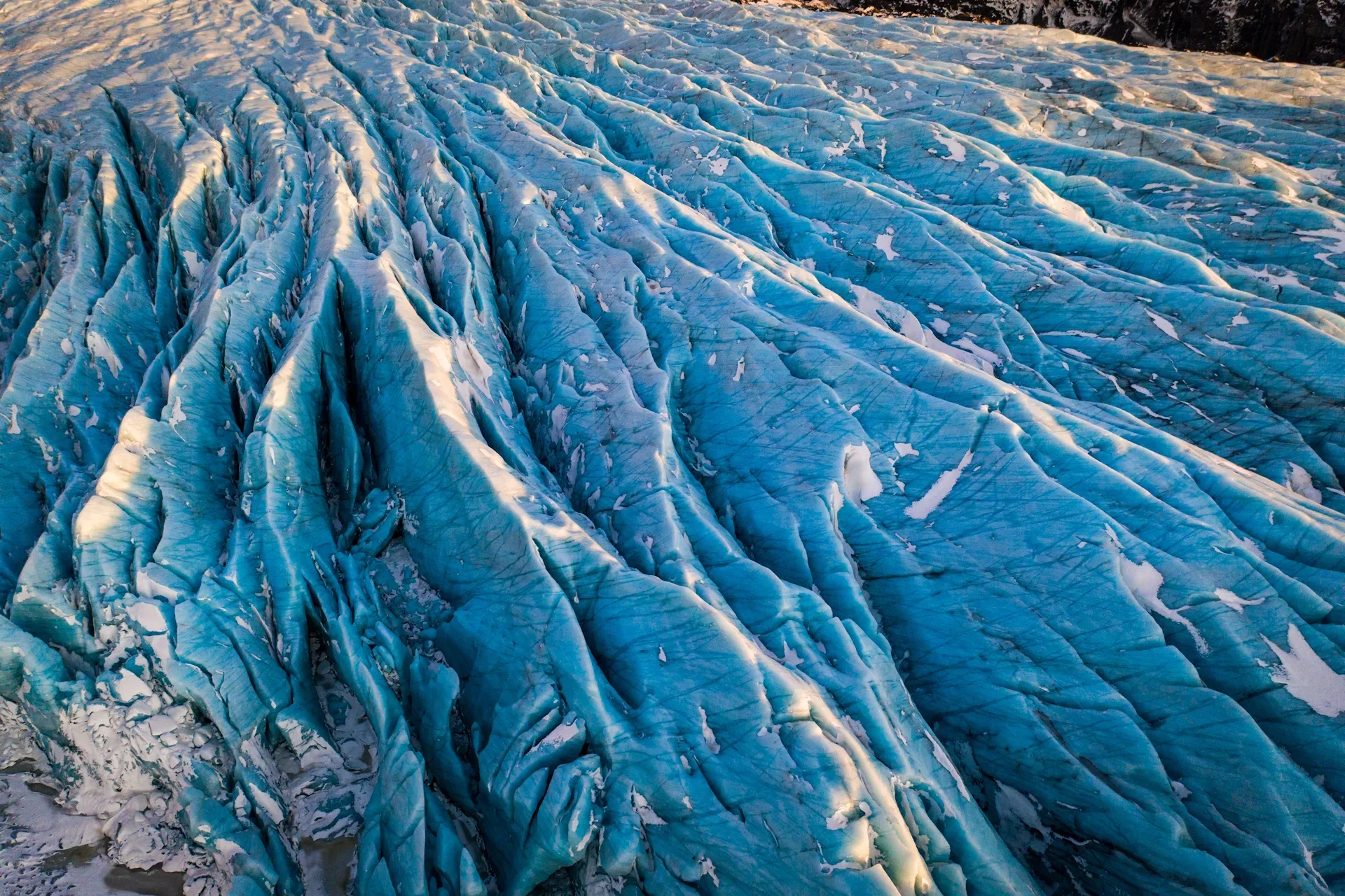 Guests hiking on the blue ice of Sólheimajökull